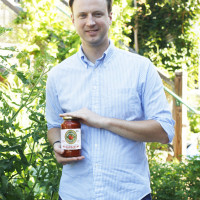 Neal holding a jar of Nellino's