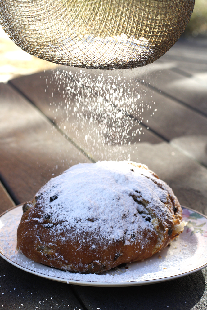 stollen with sugar dusting onto it