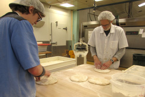 bakers shaping dough