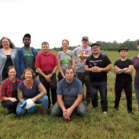 the whole group poses for a photo