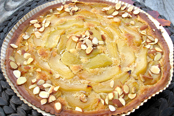 pear tart with almonds on it