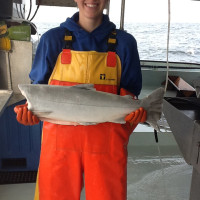 fisher woman holding fish
