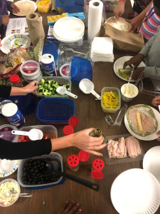 photo of table with hands preparing food