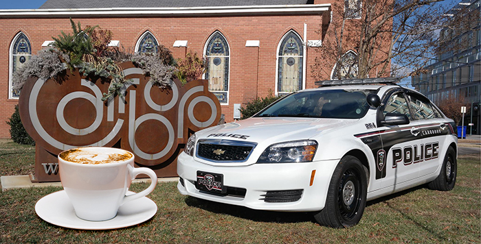 carrboro cop car with coffee mug