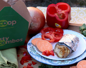 burrito on plate with vegetable ingredients