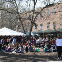 lawn at Carrboro store with tent of people