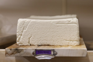 cheese on wooden shelves