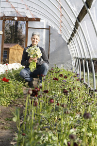 leah in greenhouse with flowers