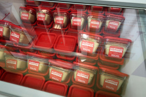 containers of hummus in a cooler