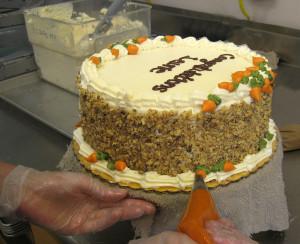 carrot cake being decorated