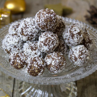 chocolate balls dipped in coconut on platter