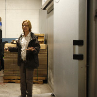 Jennifer with a large freezer door