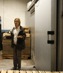 Jennifer with a large freezer door