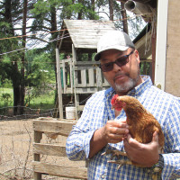 Michael holds a chicken