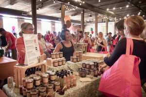 people talk to a vendor at Curds and Crafts