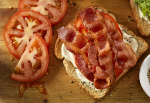 open sandwich with tomato and bacon on it