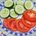 slices of tomatoes and cucumbers on a plate