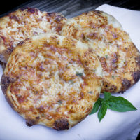 three pizzette mini pizzas