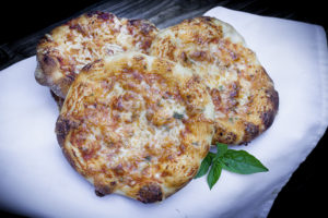 three pizzette mini pizzas