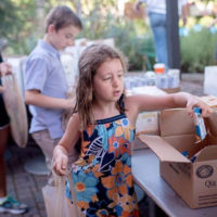 children helping sort food for TABLE