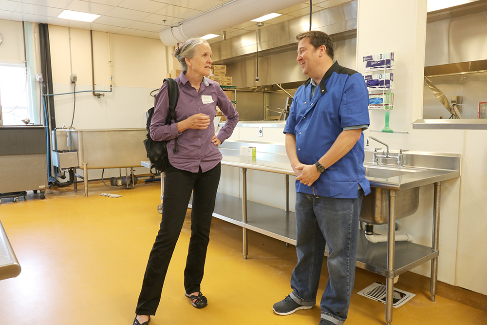 Tony greets a visitor in our kitchen