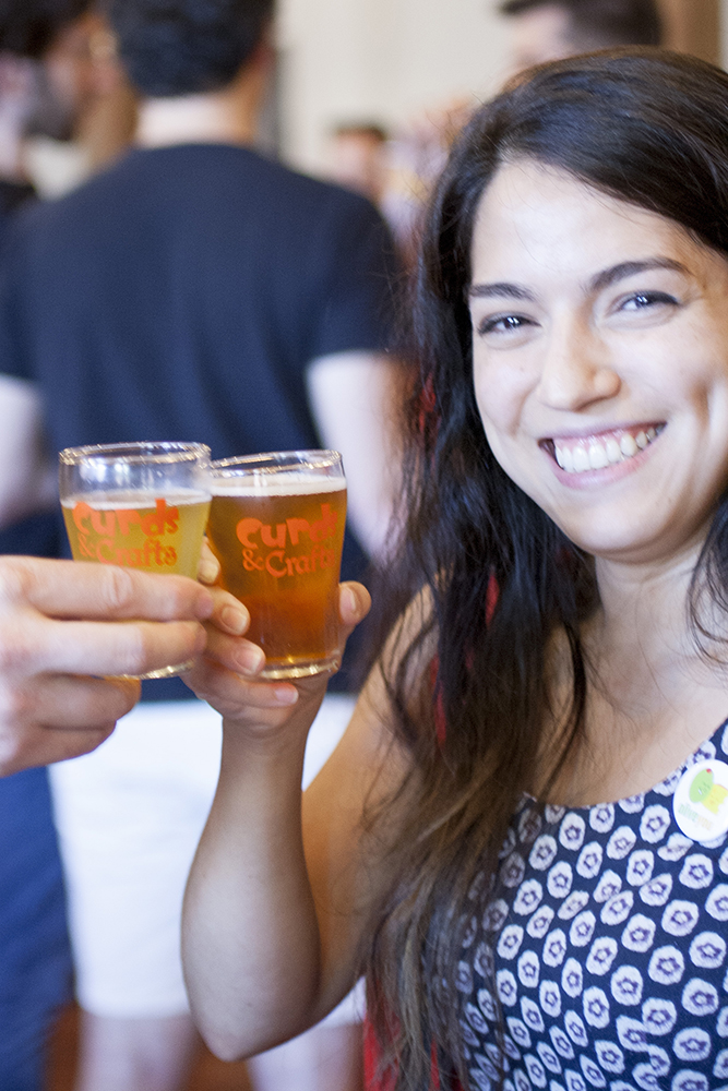 woman toasting at Curds & Crafts
