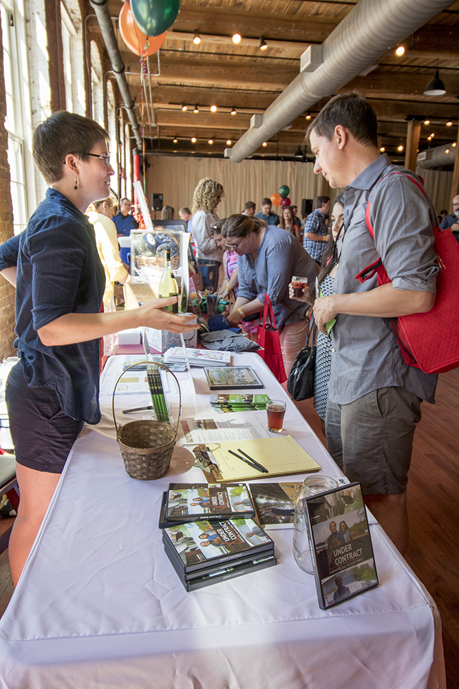 RAFI representative talking to visitors at Curds & Crafts