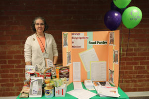 Kay from OCIM with a display about the food pantry