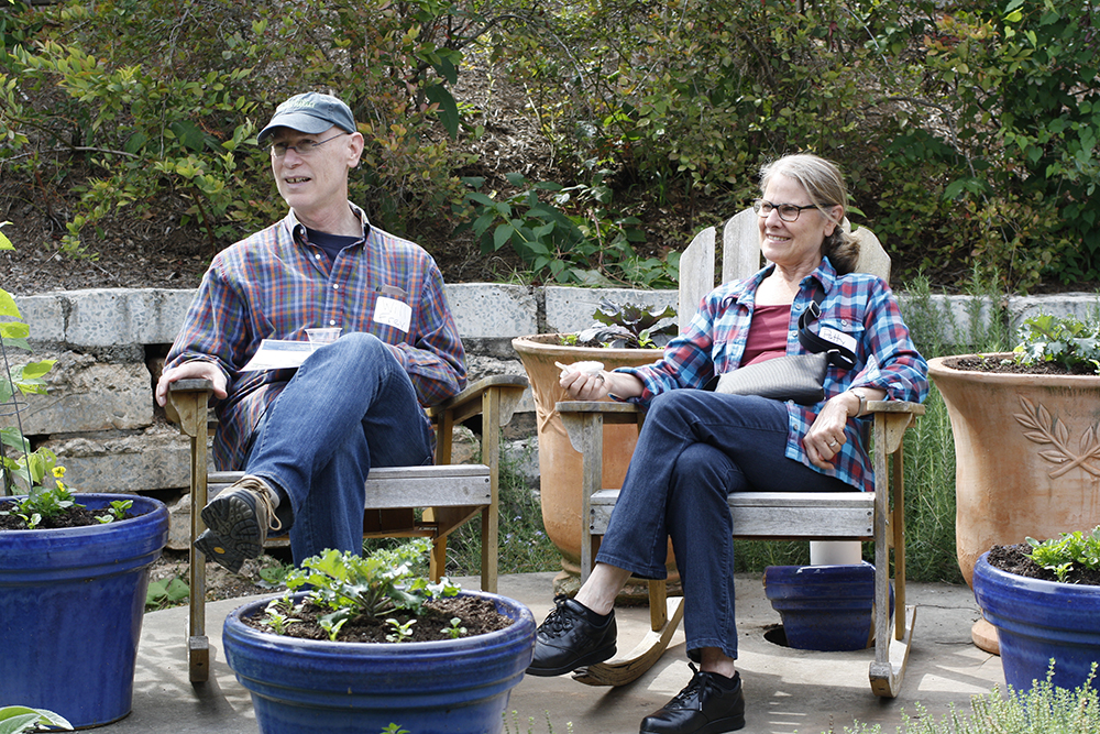 people sitting in chairs in garden