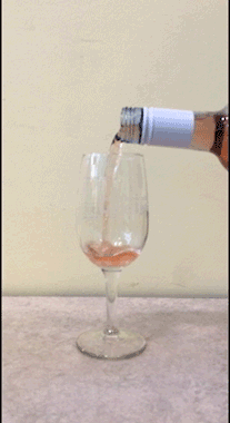 goofy animated GIF of rose pouring continuously and never filling glass