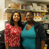 two women in the food pantry