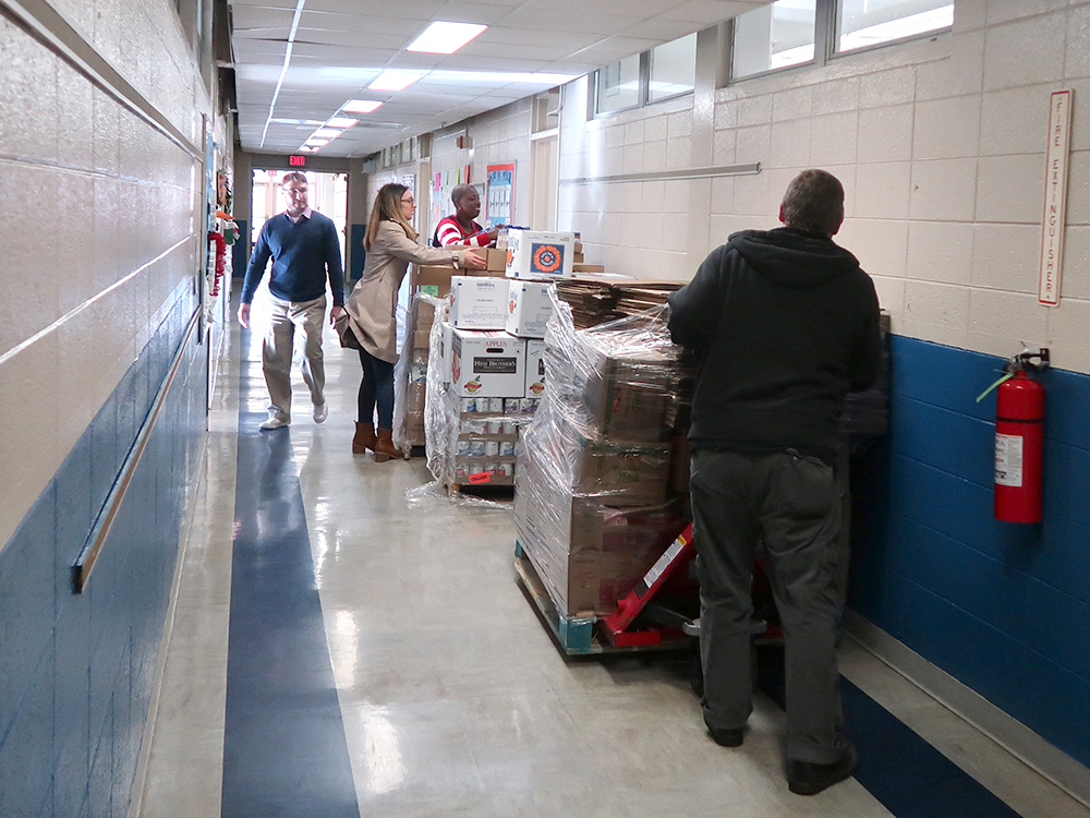 pallets of food in the hallway of a school