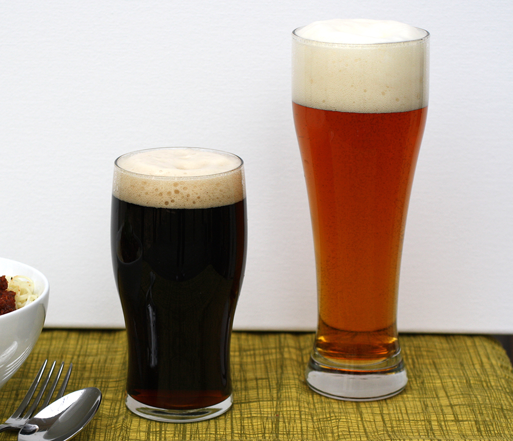 two glasses filled with beer