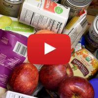 a box of groceries with a video icon