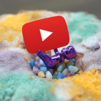 baby on king cake with video icon