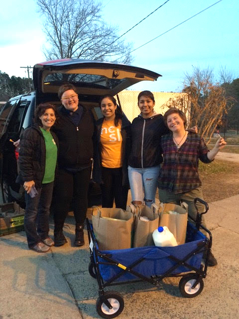 A group of people near a car