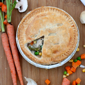 pot pie on table with vegetables