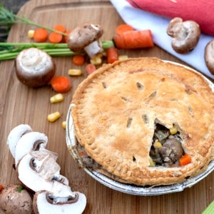 pot pie on table with vegetables