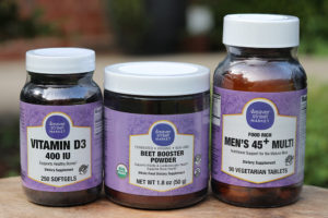 three bottles of vitamins with a Weaver Street label