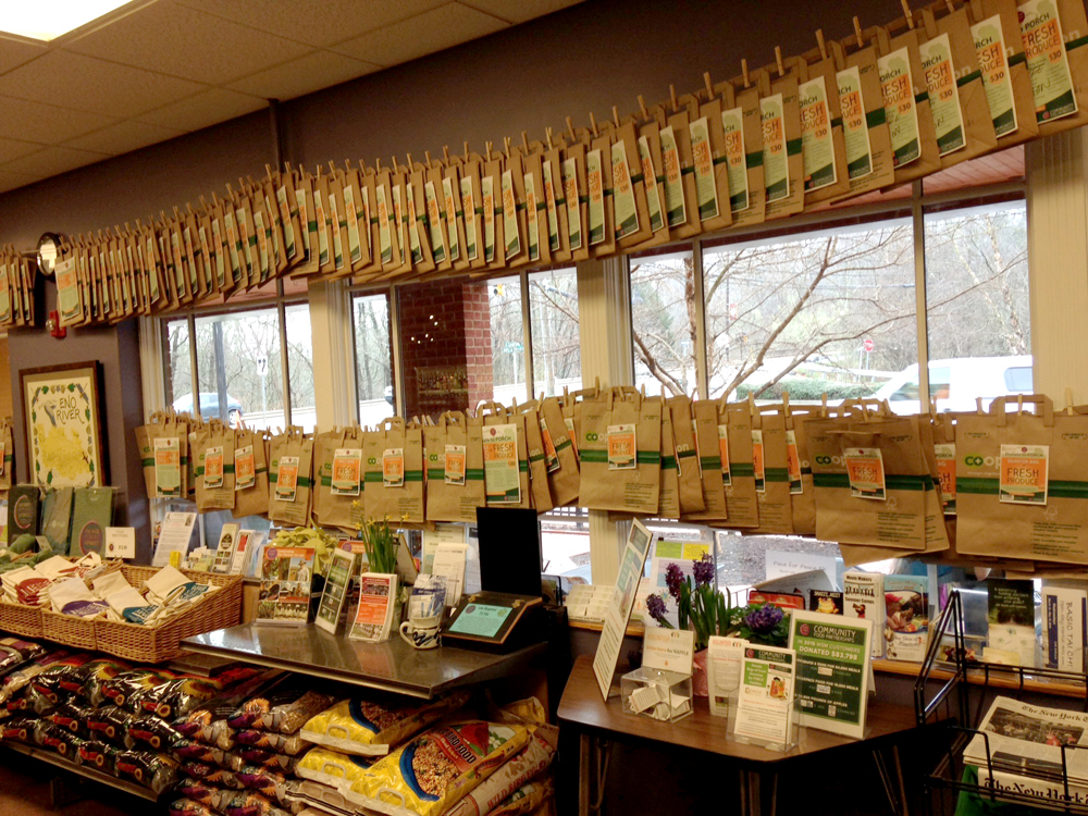 donated bags hanging in a row in the store
