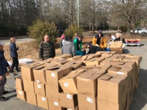 cardboard boxes piled in a parking lot