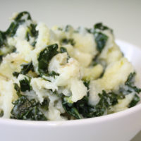 bowl of mashed potatoes with greens mixed in