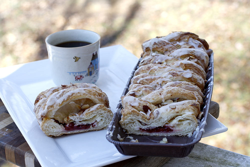 coffeecake on a table with coffee