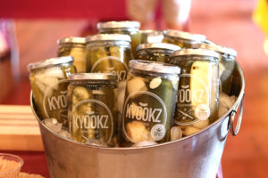 jars of pickles in a basket