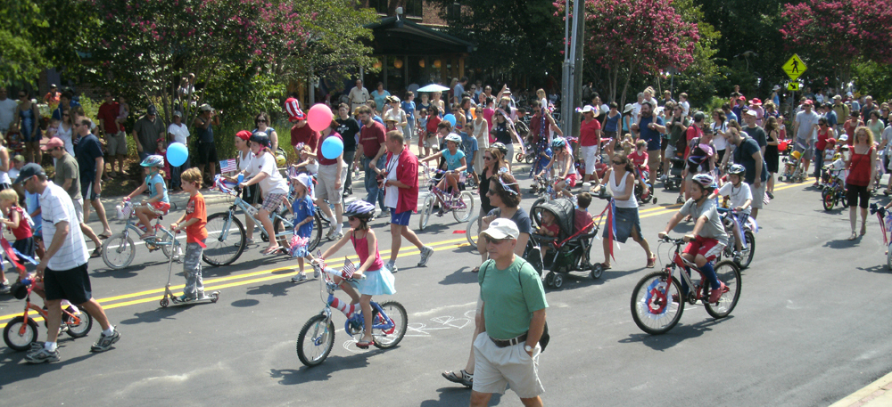 parade of people walking and bicycles