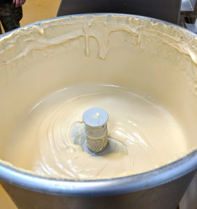 hummus in the bowl of a very large Robot Coupe mixer