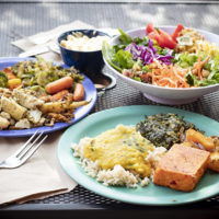 three plates of food on a table