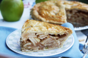 a slice of apple pie on a plate