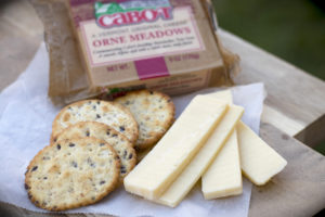 cheese slices and crackers with Cabot package of cheese