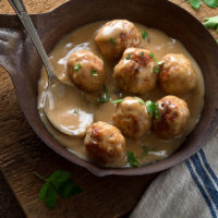 meatballs in sauce in a frying pan